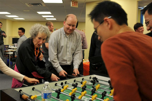 Margaret Atwood at the Wattpad office playing a game of foosball